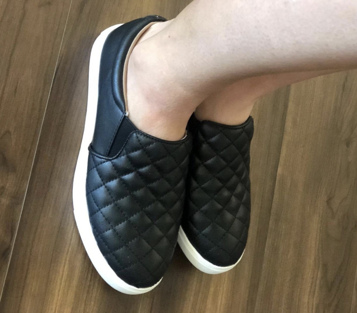 reviewer wearing the shoes in black