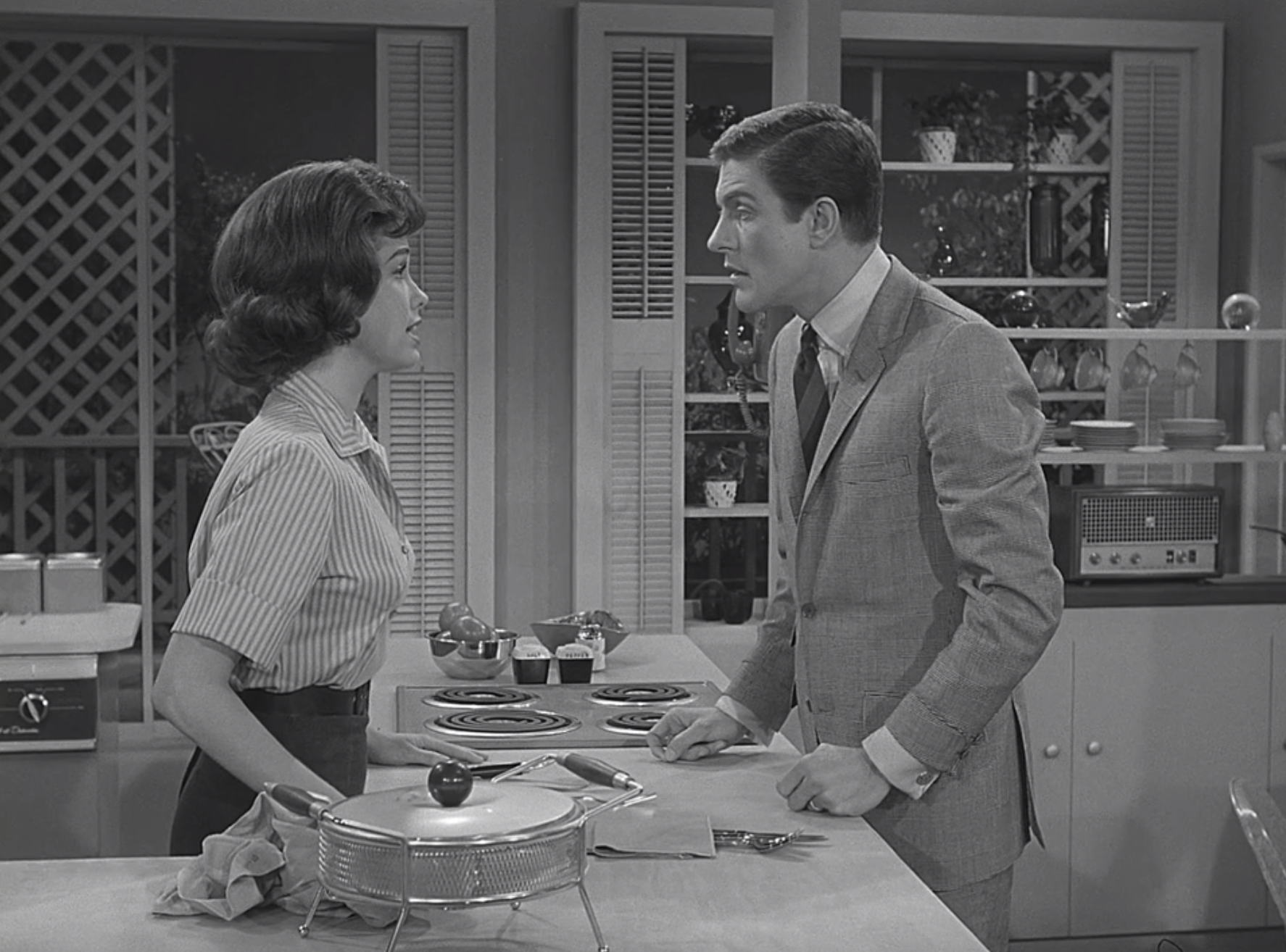 Mary Tyler Moore and Dick Van Dyke have a conversation in the kitchen as Laura and Rob on &quot;The Dick Van Dyke Show&quot;