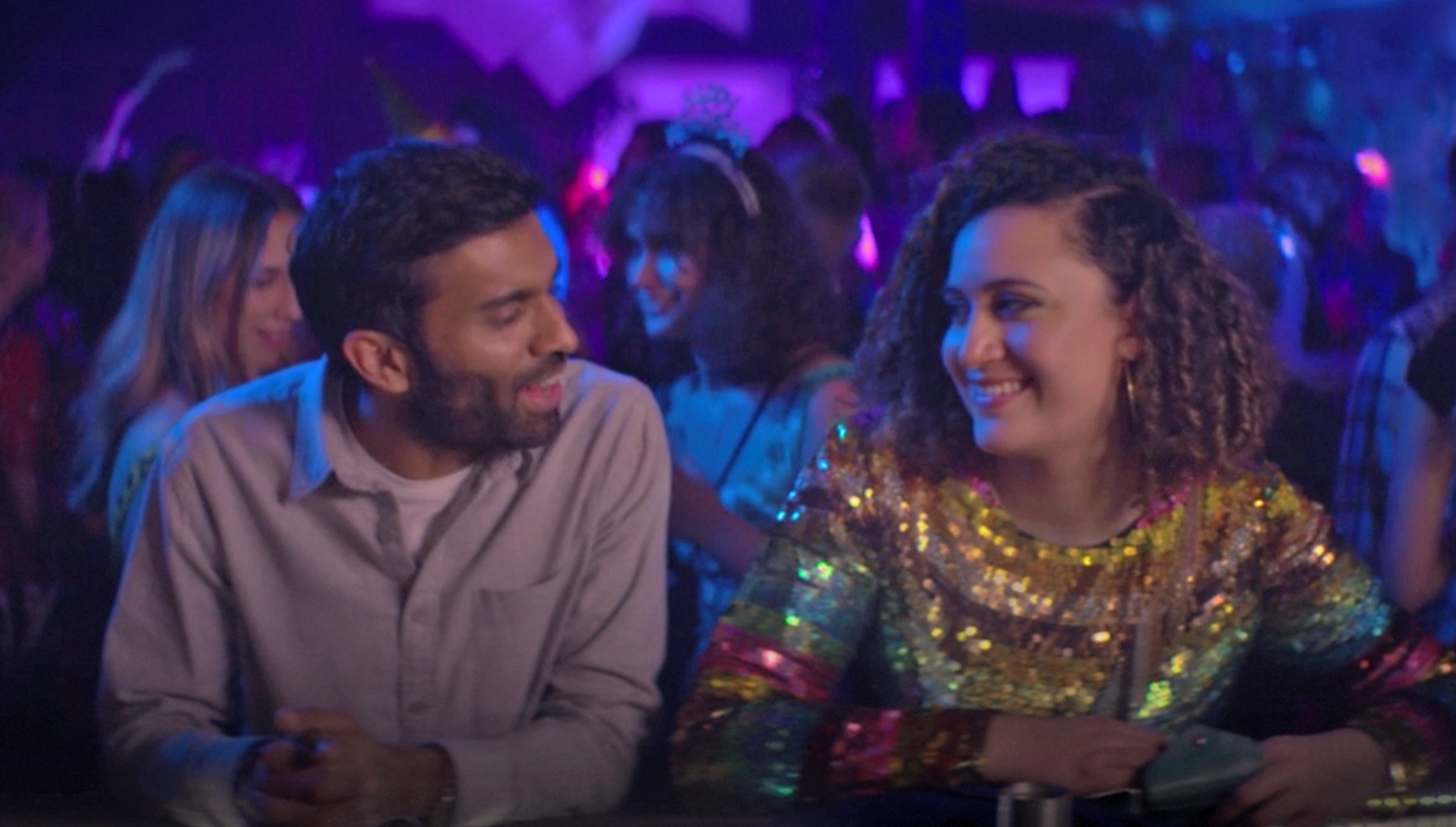 Nikesh Patel and Rose Matafeo sitting at a bar as Tom and Jessie on &quot;Starstruck&quot;