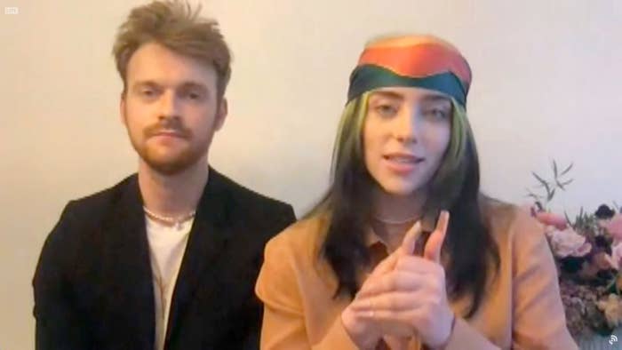 Finneas O&#x27;Connell and Billie Eilish accept an award at the 2021 Grammy Awards