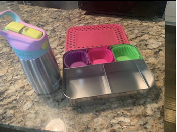 Reviewer's photo showing three reusable silicone baking cups in a lunch box
