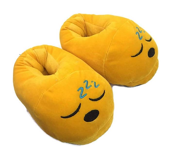 Plush slippers with a sleeping face emoji design
