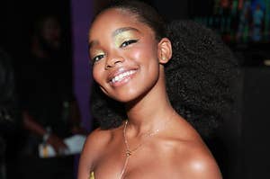 Marsai Martin smiles wearing a shiny strapless dress and rings on her fingers