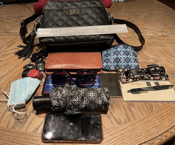 the purse and a bunch of stuff that fits inside of it