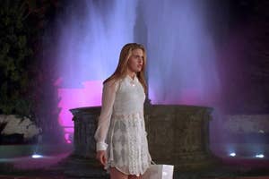Cher standing in front of a fountain in Clueless