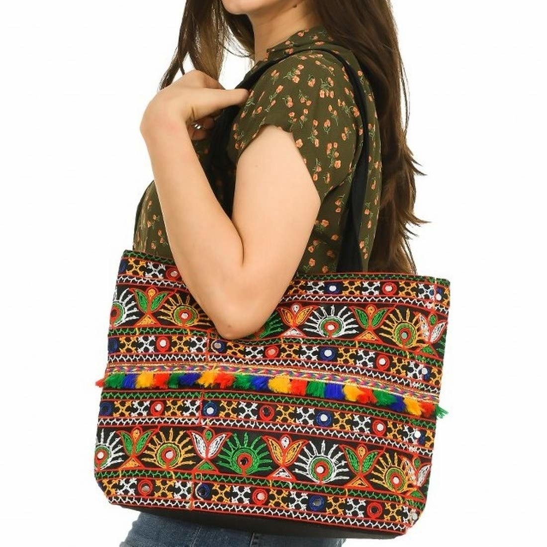 A multi-coloured Rajasthani-style handbag with embroidery and mirrors sewn on it