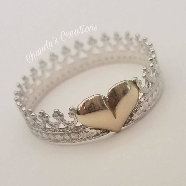 the crown shaped ring with a heart in the center