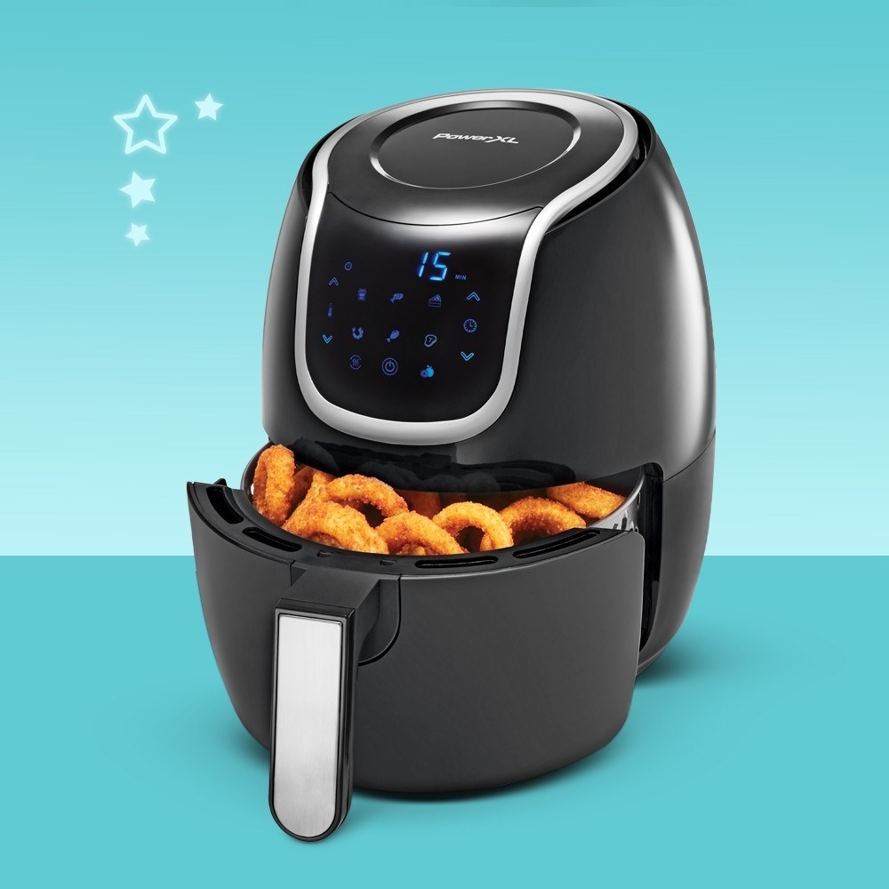 the air fryer with onion rings in it