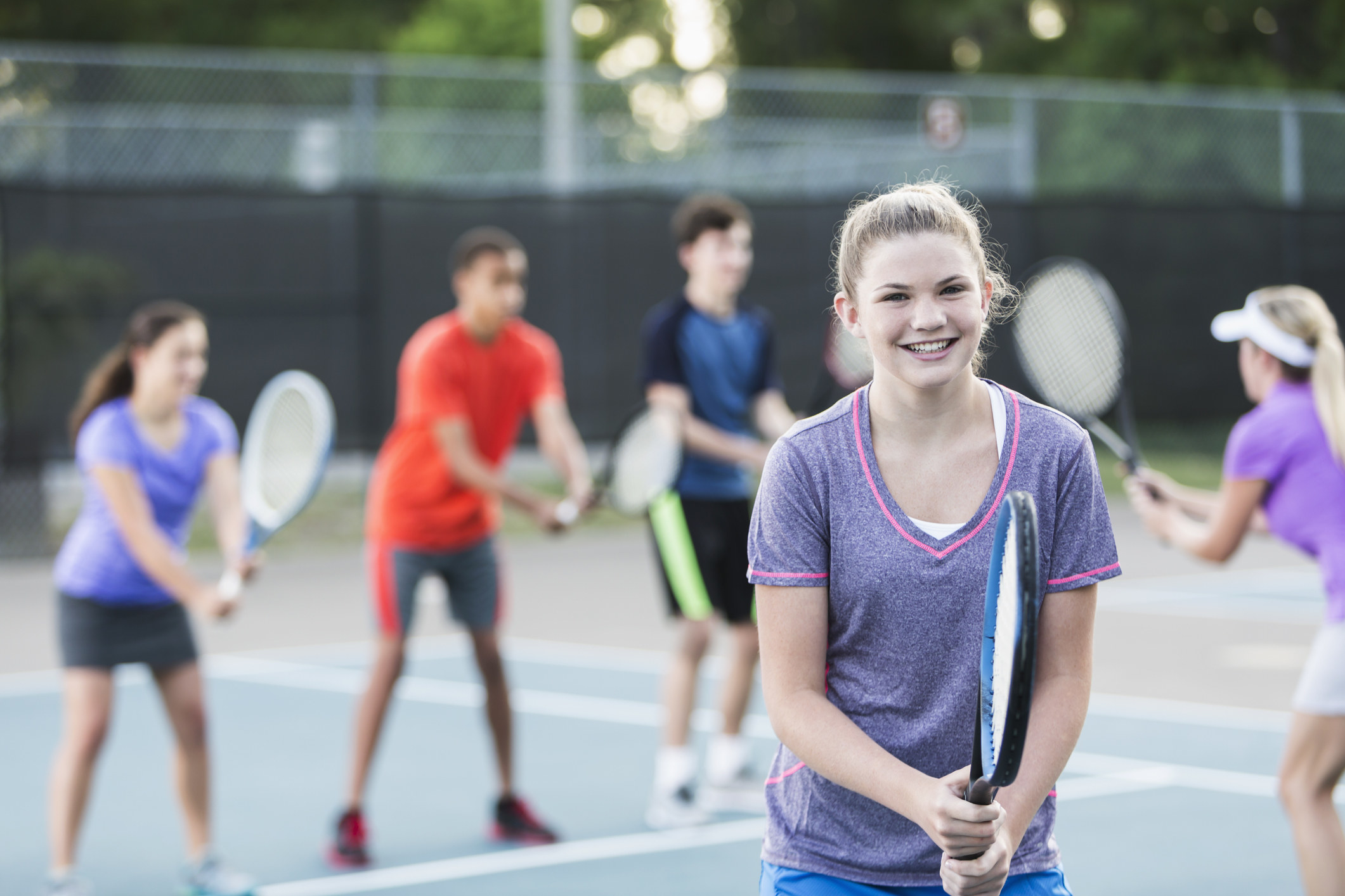 A girl playing tennis