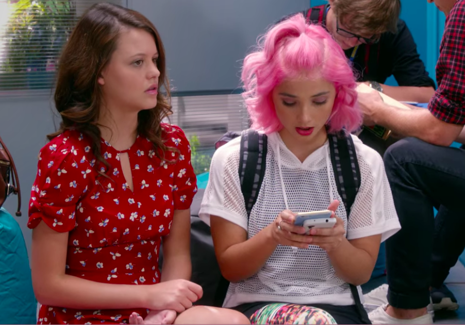 Lola texting on her phone next to Frankie on Degrassi