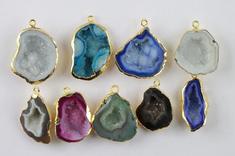 nine different colored druzy pendants