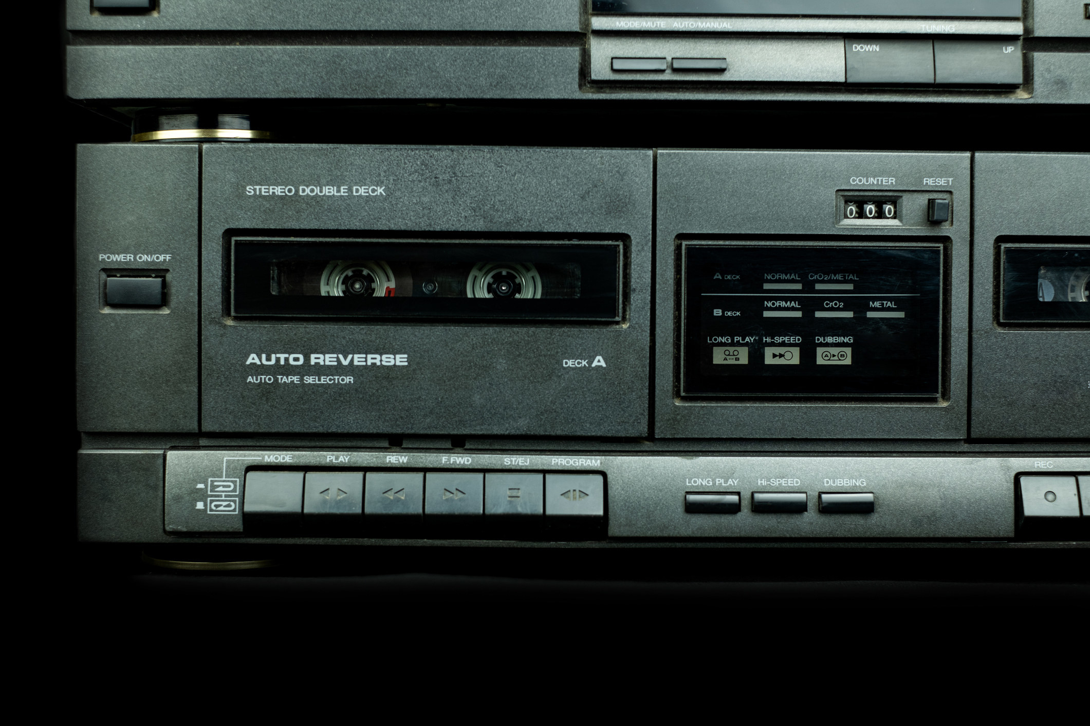 Close up front a deck recorder of the vintage stereo cassette tape player with the push operation buttons are retro technology