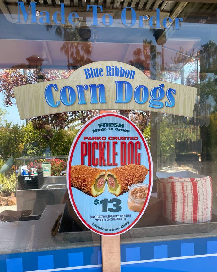 Blue Ribbon Corn Dogs cart sign advertising the panko custed pickle dog