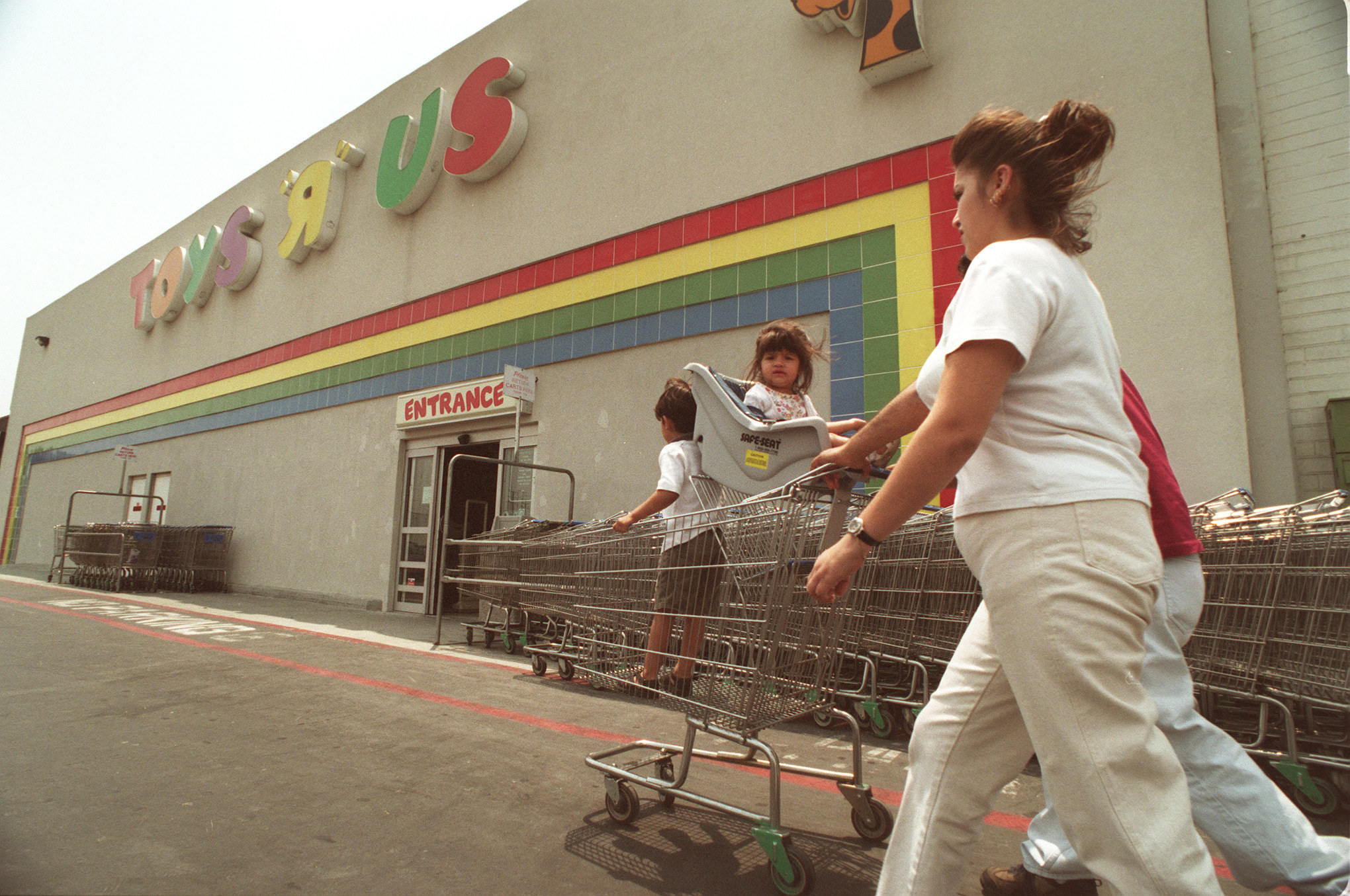 A Family walking into a Toys R Us