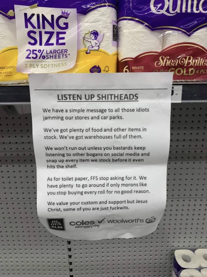 A grocery store shelf with a sign attached asking people to stop hoarding items like toilet paper