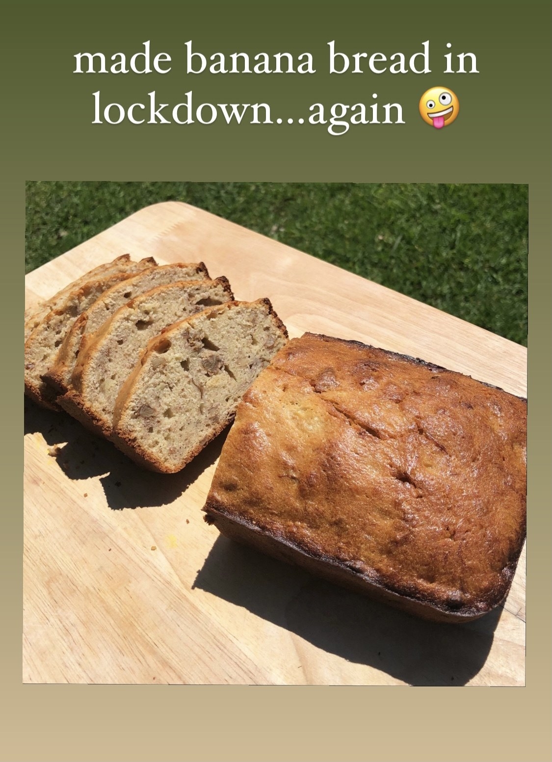 A picture of a loaf of banana bread cut into slices; it is captioned &quot;made banana bread in lockdown...again&quot;