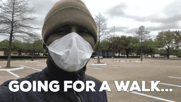 A man wearing a mask saying &quot;going for a walk&quot;