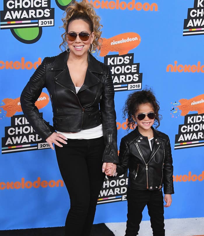 Mariah holds Monroe&#x27;s hand as they wear matching leather jackets, black jeans, and aviator sunglasses