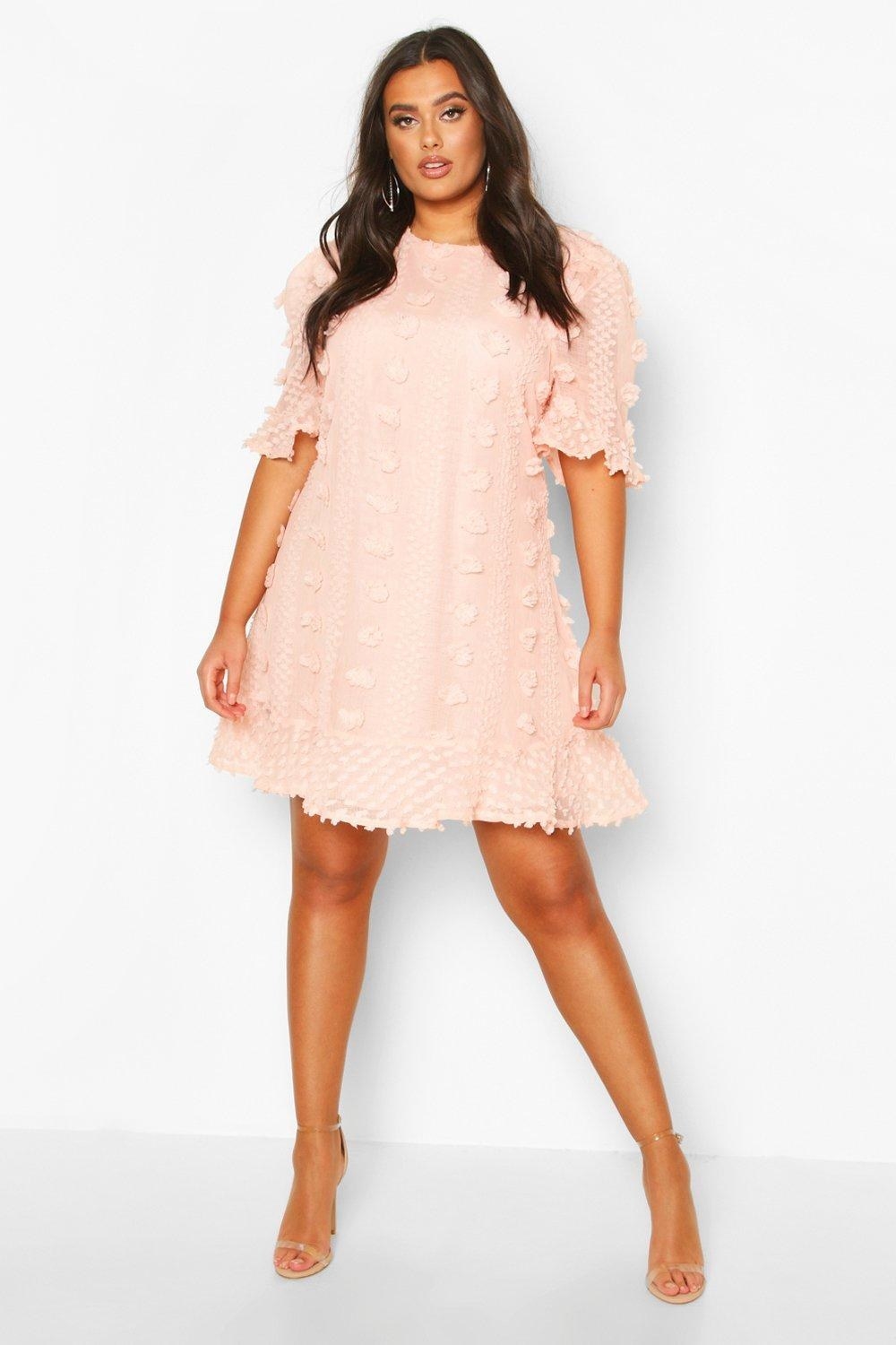 a model in the blush smocked dress