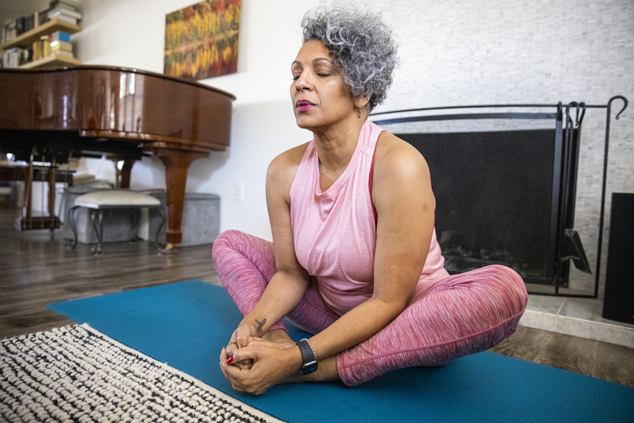 woman doing yoga in her house