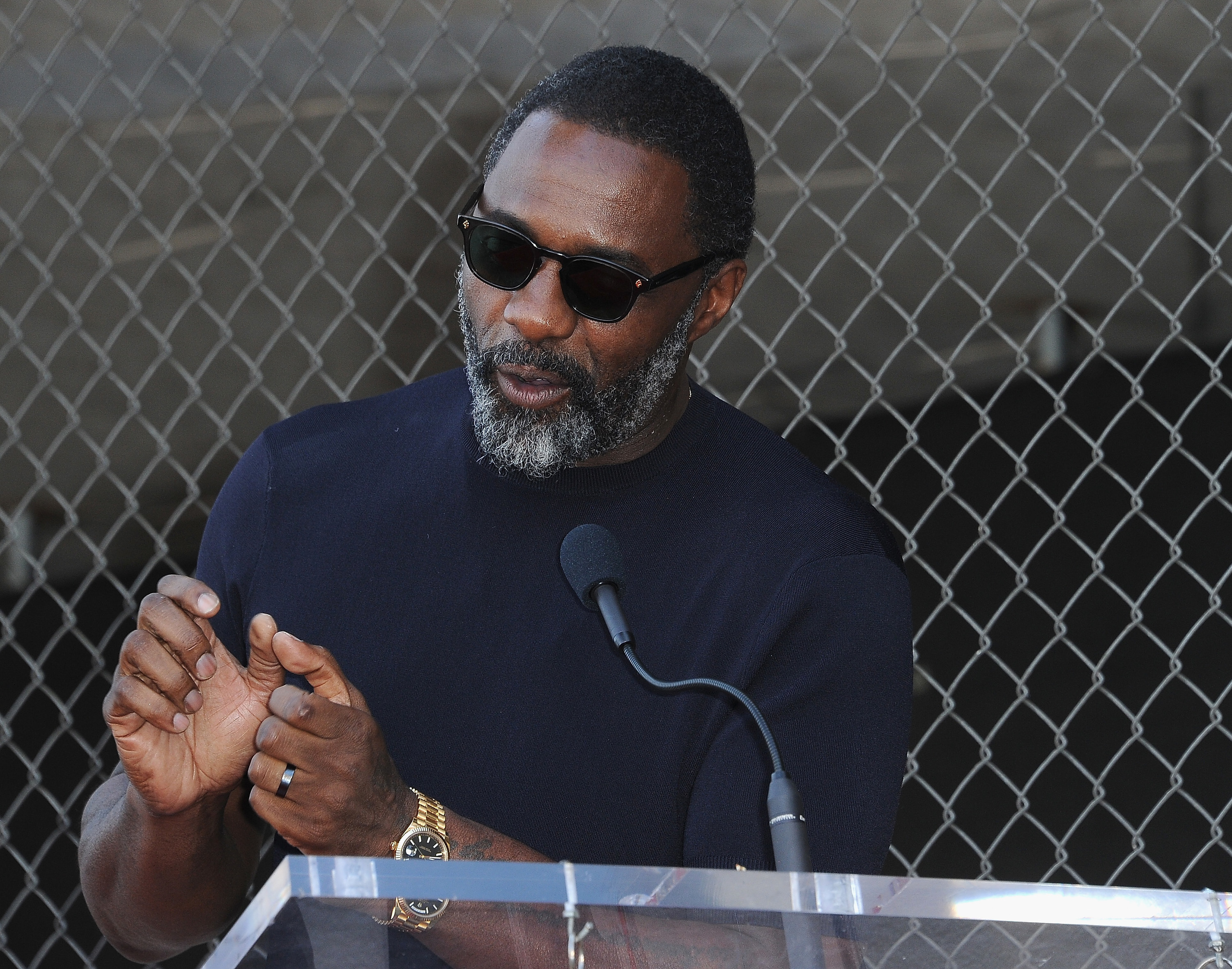Idris Elba speaks at a podium during Tyler Perry&#x27;s star ceremony on the Hollywood Walk of Fame