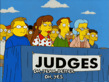 judges discussing a performance on The Simpsons