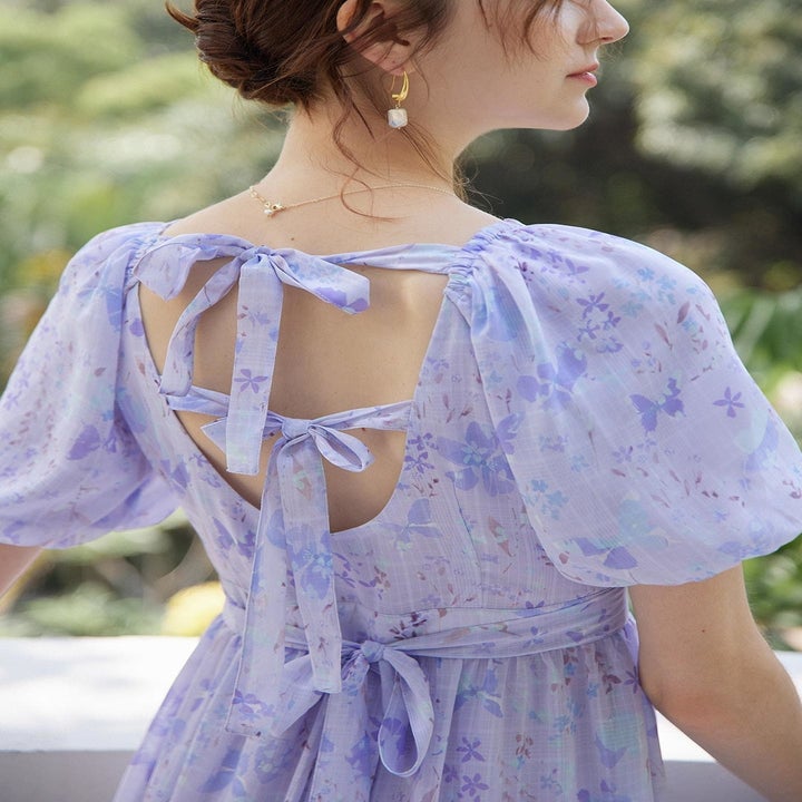 model showing back of dress with bows