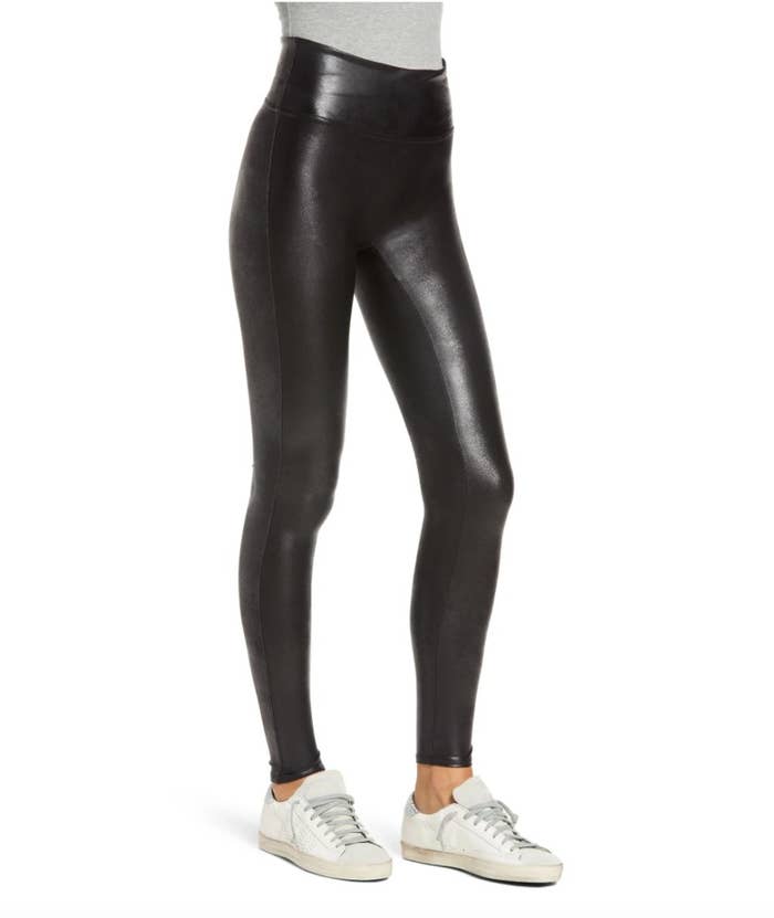 model wearing black fake leather leggings