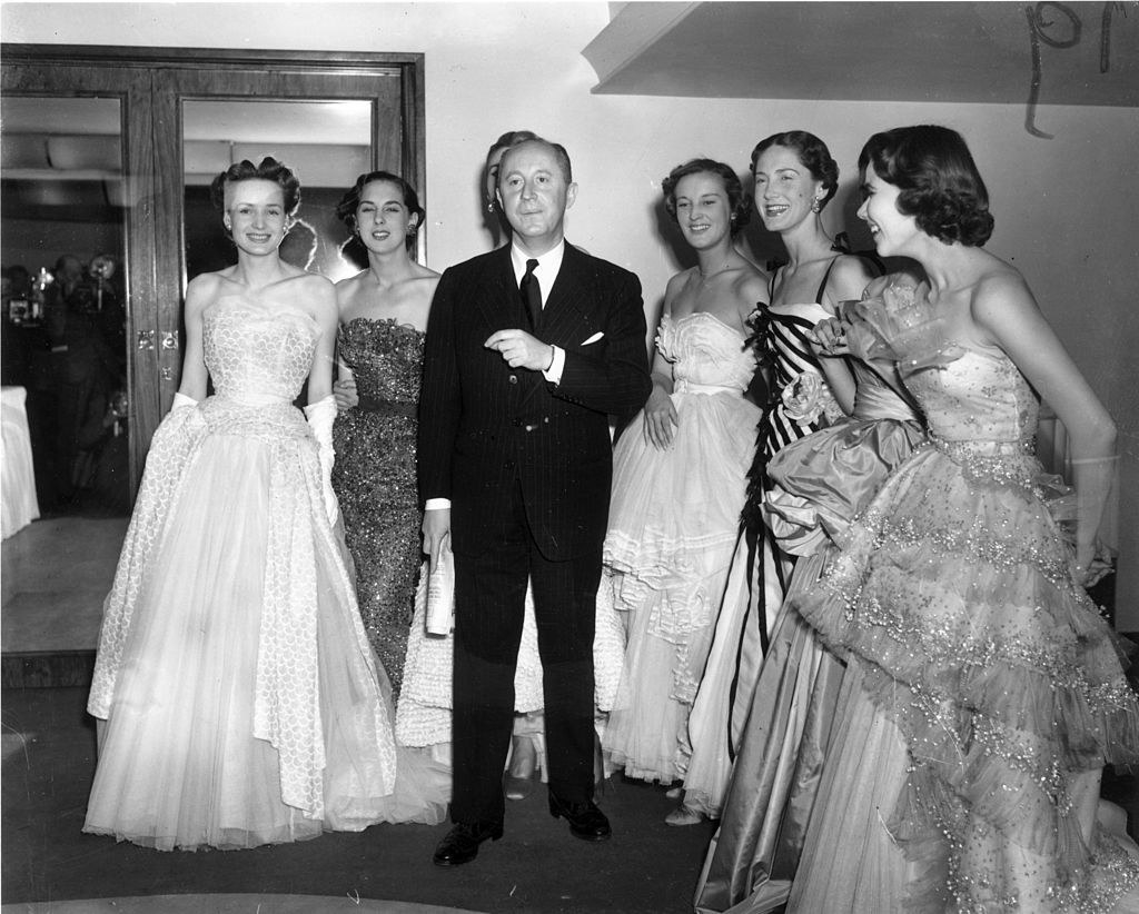 Christian Dior with a group of models wearing his looks