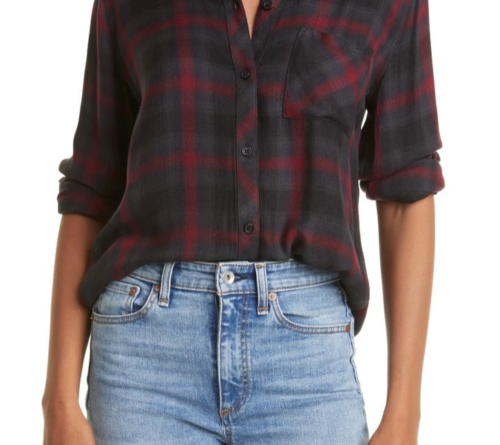 Model wearing a red button down with jeans