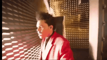 The Weeknd running dazed through mirrored hallways during the Super Bowl halftime show
