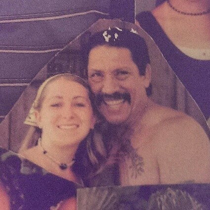 BuzzFeed user posing with Danny Trejo at his house in what looks like the 2000s