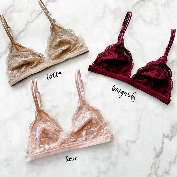 three lace bralettes whch are beige, pink, and burgundy respectively