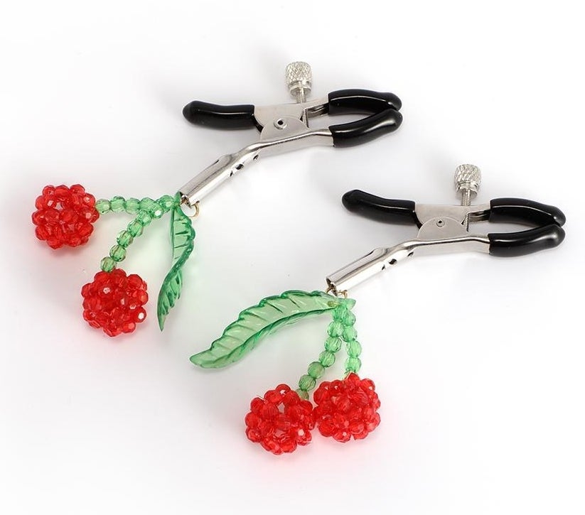 Silvertone and black nipple clamps with red and green beaded cherries