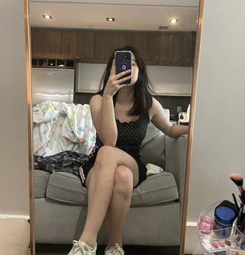Writer mirror selfie wearing the Reebok sneakers
