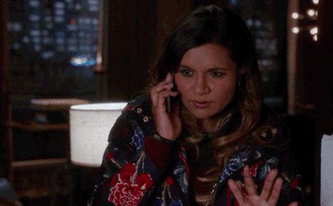 Mindy Kaling on &quot;The Mindy Project&quot; talking on the phone and looking confused
