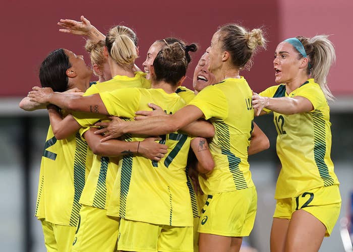 Sam Kerr of Australia is congratulated by team mates after she score her sides second goal during the Women's First Round Group G match during the Tokyo 2020 Olympic Games