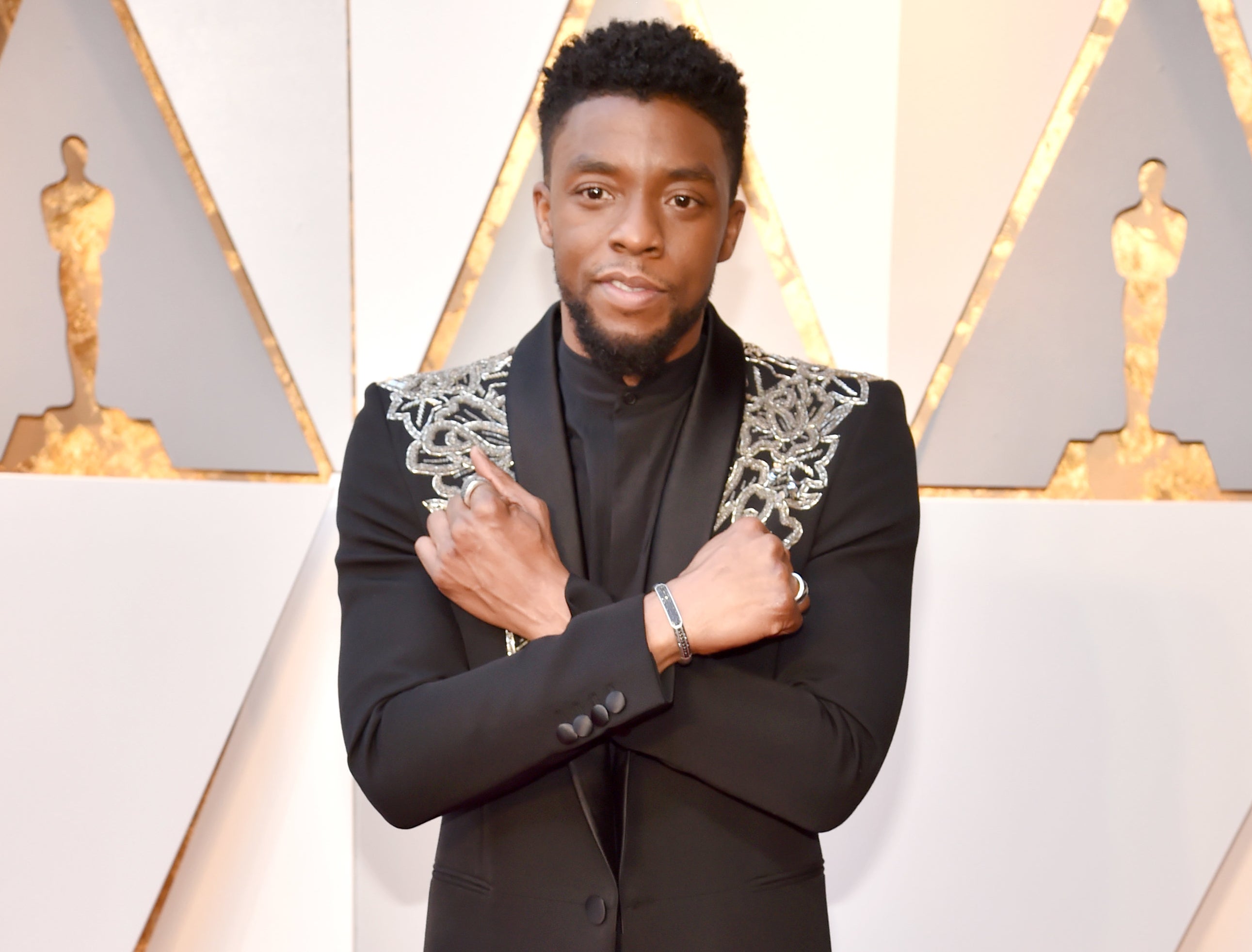Chadwick gives the Wakanda Forever sign