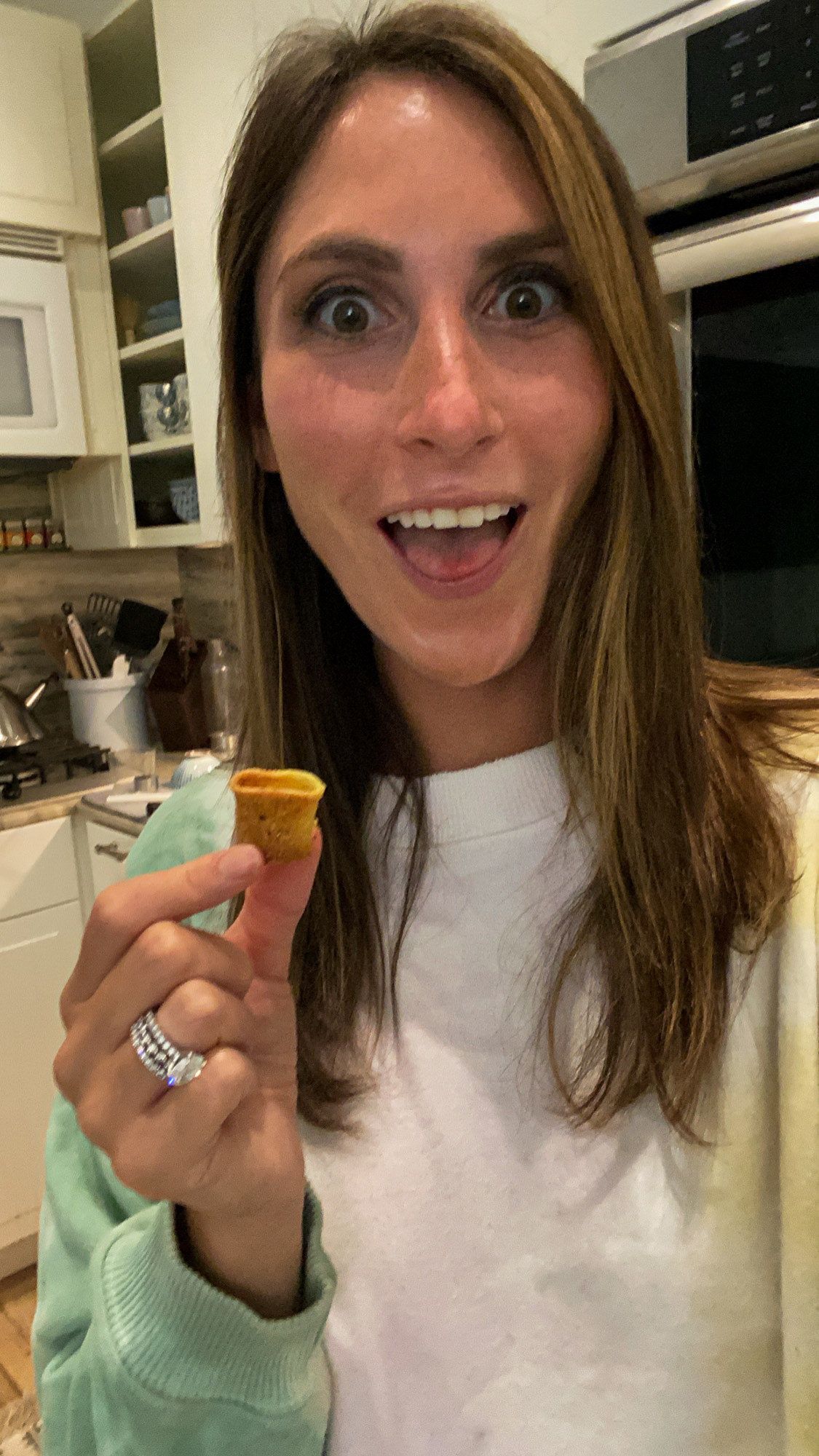 Me holding a rigatoni pasta chip.