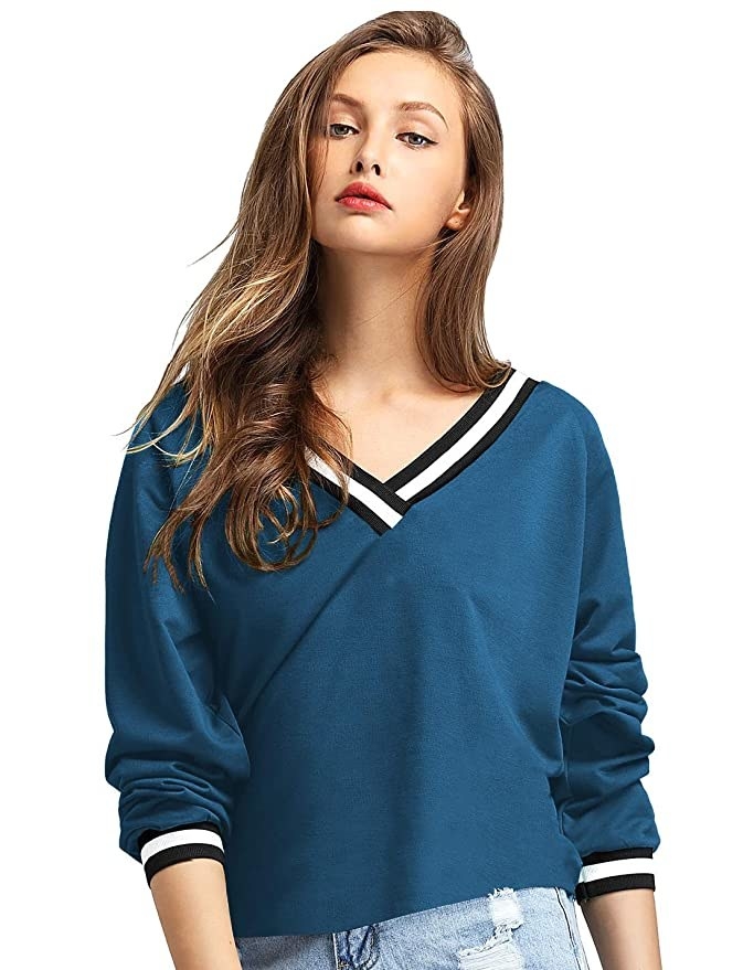 Blue top with black and white collar details