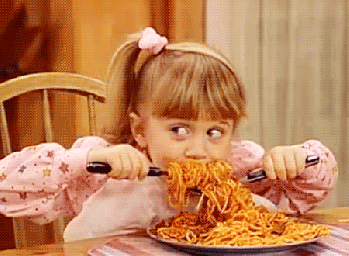 Miichelle Tanner from &quot;Full House&quot; digging into a bowl of spaghetti.