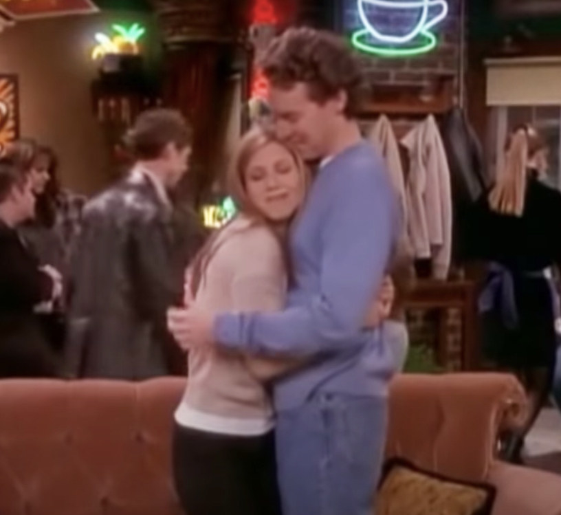 Rachel hugs Joshua in the middle of Central Perk
