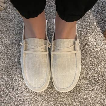 a reviewer wearing the shoes in tan 