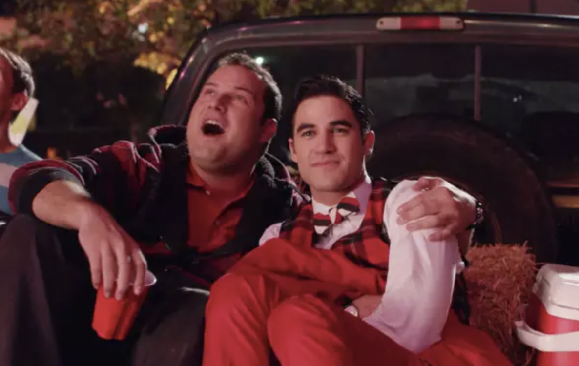 Dave and Blaine cuddling in the back of a truck