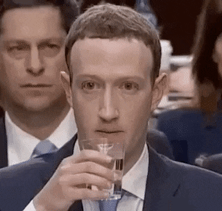 Mark Zuckerberg nervously sipping water