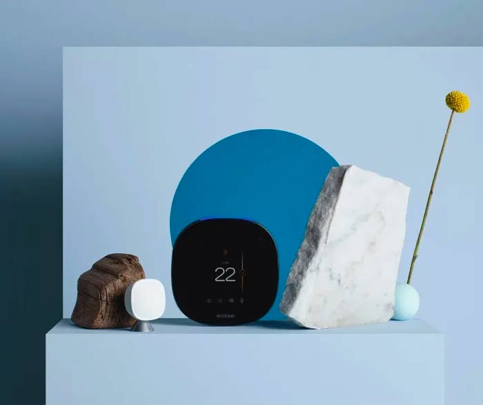 the smart thermostat surrounded by decorative stones