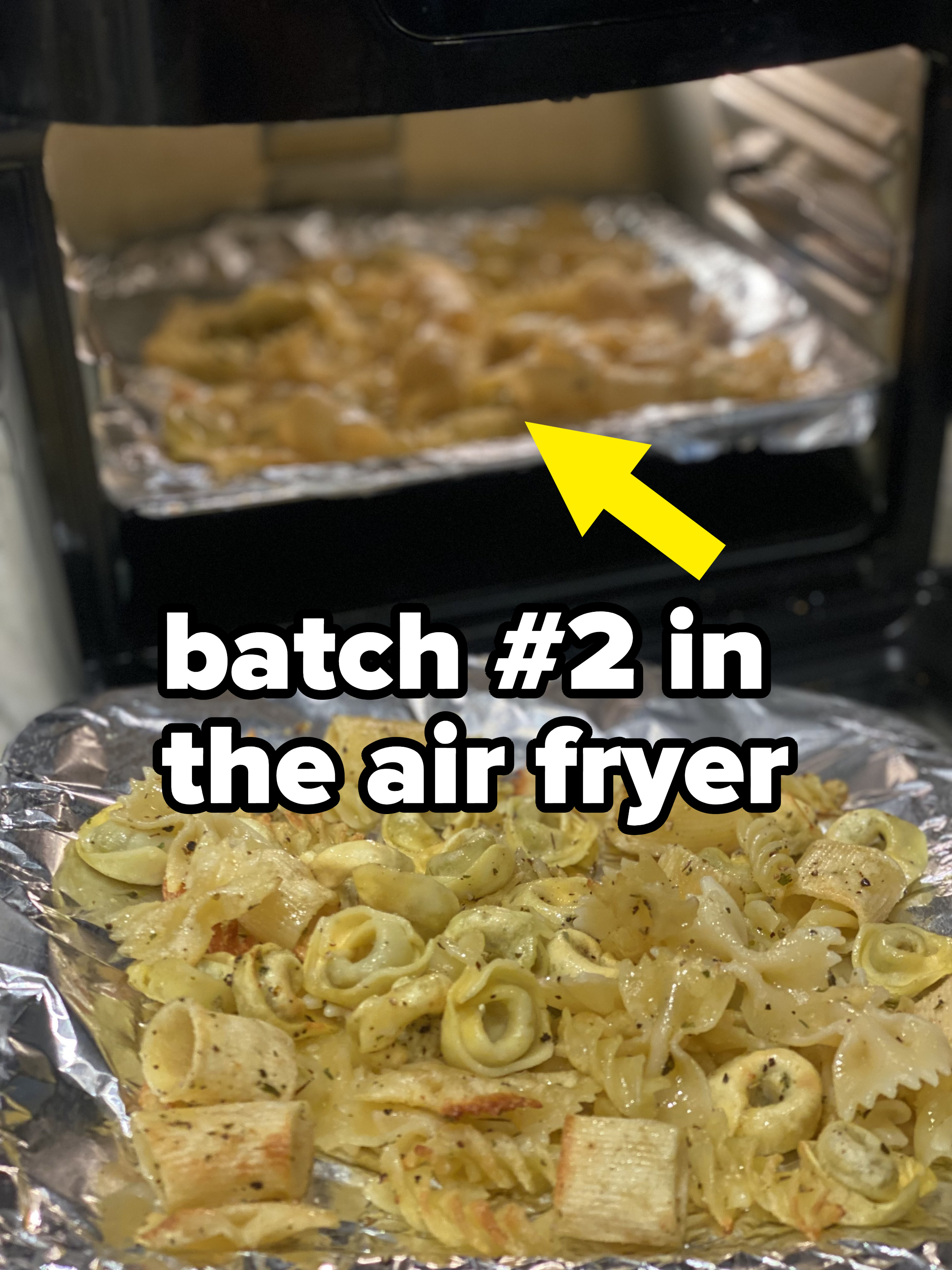 Pasta beginning to turn slightly golden in the air fryer.