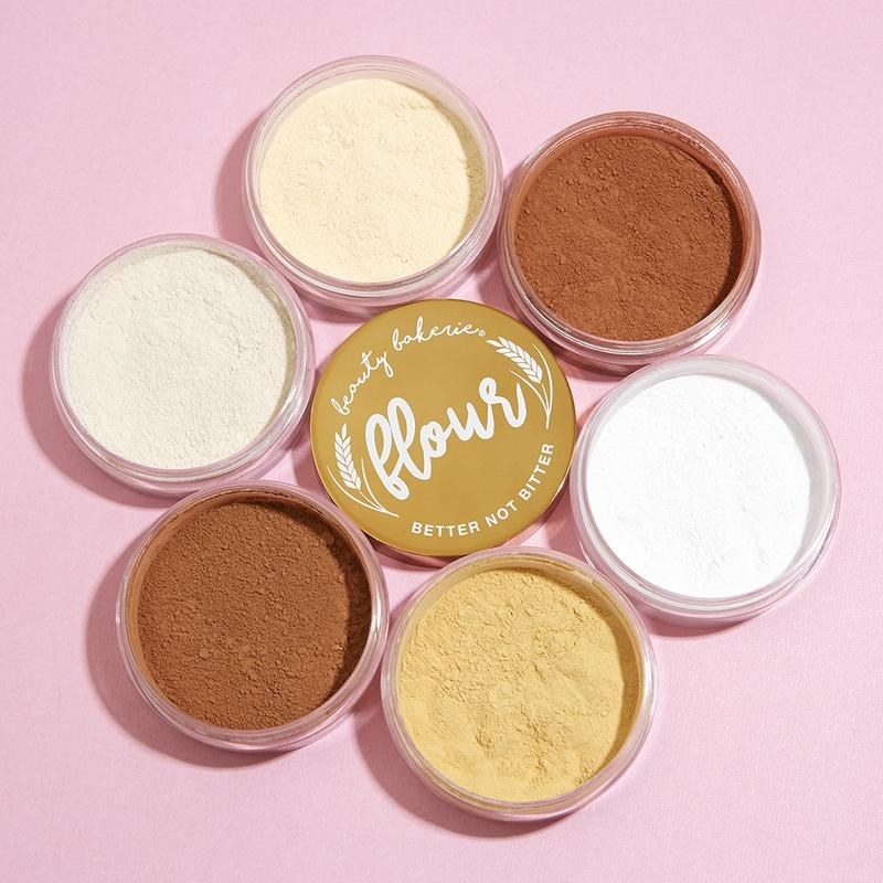 Containers of the setting powder in different shades arranged in a circle