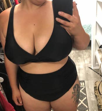 reviewer wearing the black two piece