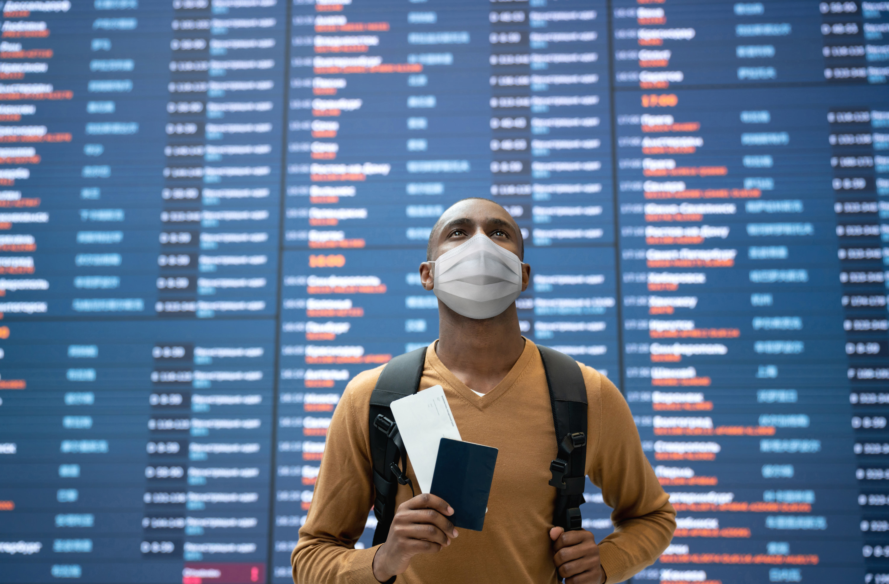 A traveler holding travel documents